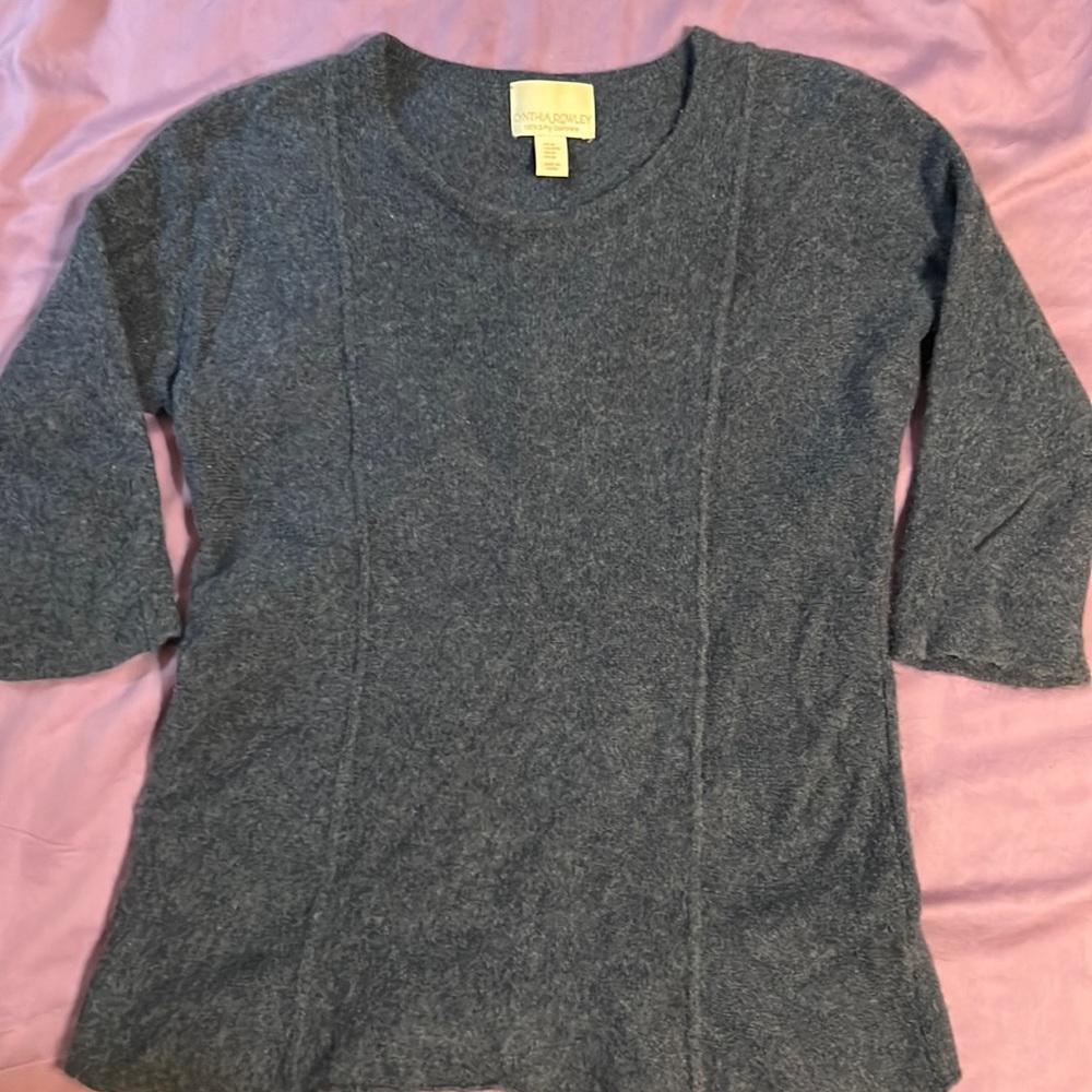 A beautiful, soft cashmere sweater in blue.   Fits more like a small/Medium